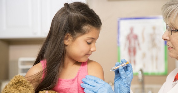 child receiving vaccine at doctors
